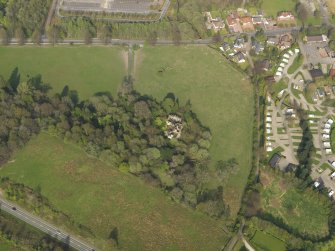 Oblique aerial view centred on the remains of the Country House, taken from the SW.