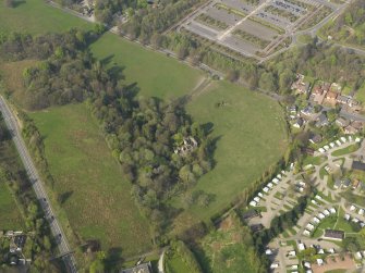 Oblique aerial view centred on the remains of the Country House, taken from the SSW.