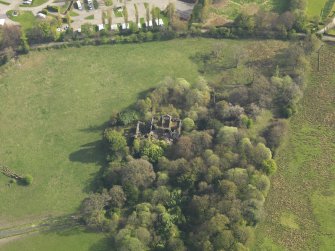Oblique aerial view centred on the remains of the country house, taken from the NNW.