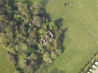 Oblique aerial view centred on the remains of the country house, taken from the SW.