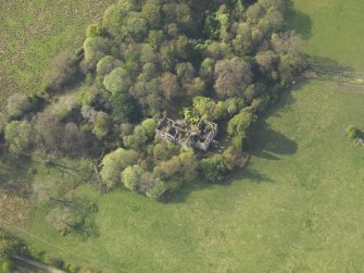 Oblique aerial view centred on the remains of the country house, taken from the SE.