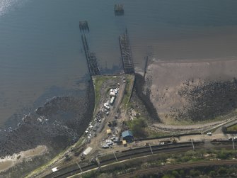Oblique aerial view centred on the remains of the pier, taken from the ENE.