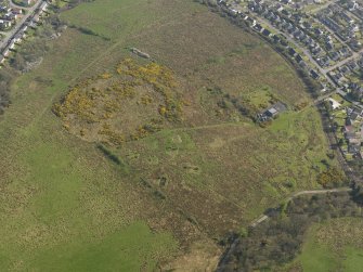 Oblique aerial view centred on the remains of the heavy anti aircraft battery, taken from the NW.