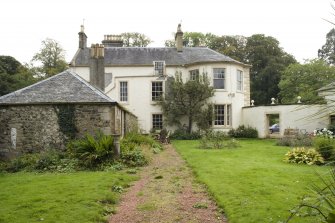 House and outbuildings, view from W