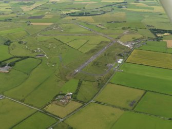 General oblique aerial view centred on the airfield, taken from the NE.