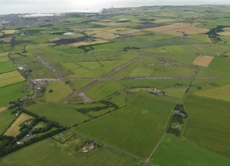 General oblique aerial view centred on the airfield, taken from the WNW.