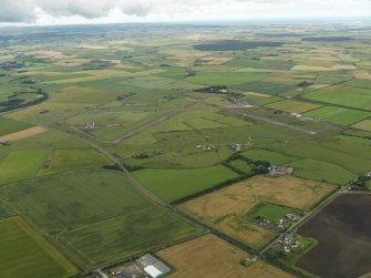 General oblique aerial view centred on the airfield, taken from the SE.