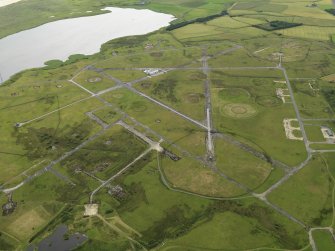 General oblique aerial view centred on the airfield, taken from the WNW.