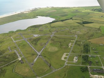 General oblique aerial view centred on the airfield, taken from the W.
