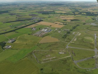 General oblique aerial view centred on the airfield, taken from the E.