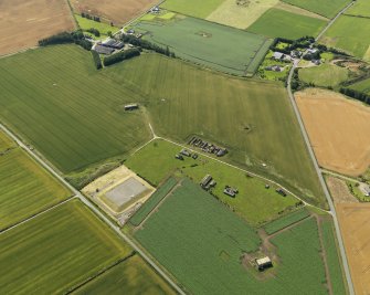 General oblique aerial view centred on the remains of the radar station, taken from the NW.