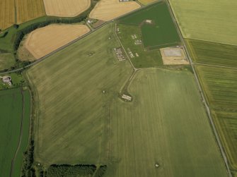 General oblique aerial view centred on the remains of the radar station, taken from the ESE.