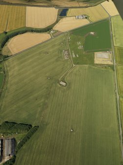 General oblique aerial view centred on the remains of the radar station, taken from the ESE.