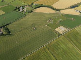 General oblique aerial view centred on the remains of the radar station, taken from the NE.