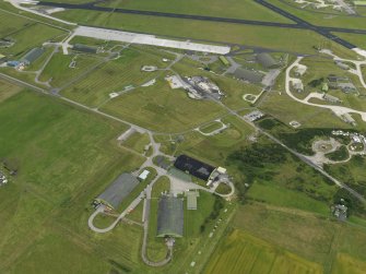 General oblique aerial view centred on the N dispersal areas, taken from the NW.