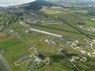 General oblique aerial view centred on the airfield, taken from the NW.