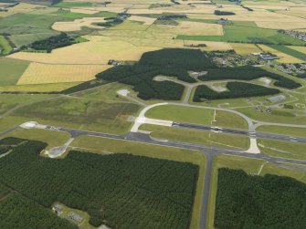 General oblique aerial view centred on the airfield, taken from the NNW.