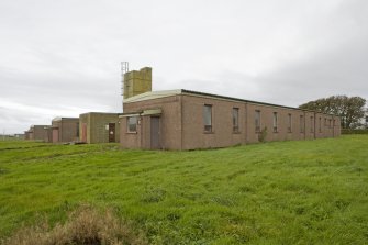 View from ENE of single quarters transit and single quarters SM huts.