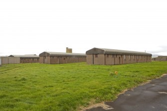 View from N of single quarters transit and single quarters SM huts.