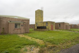 View from SW of boiler house between single quarter huts.