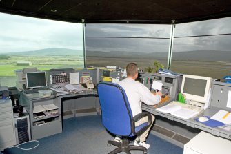 Interior view of flight control panels with controller in position.