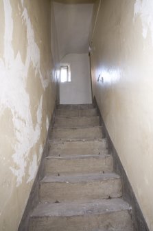 Interior. View looking up stairs from painted ceiling room