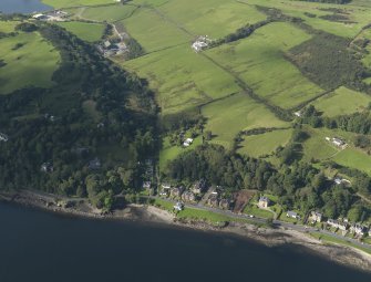 General oblique aerial view of the houses and cottages, taken from the ENE.
