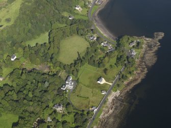 General oblique aerial view centred on the church, taken from the SSE.