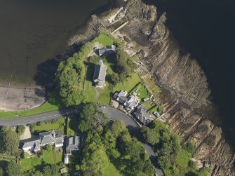 Oblique aerial view centred on the church, taken from the SW.