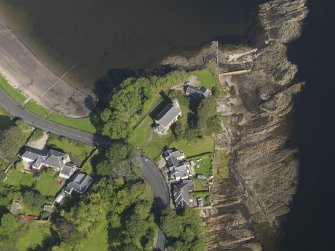 Oblique aerial view centred on the church, taken from the NE.