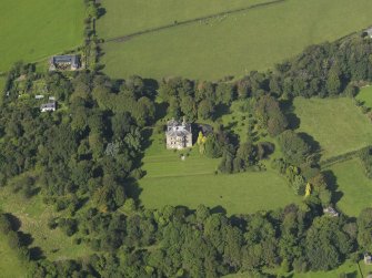 Oblique aerial view centred on the house, taken from the E.