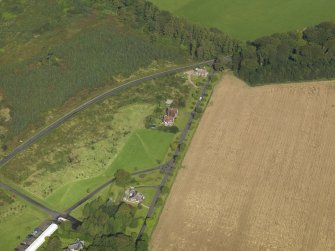 General oblique aerial view centred on the schoolhouse, taken from the SSE.