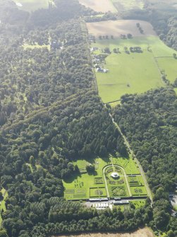 General oblique aerial view centred on the gardens, looking towards the kennels and house, taken from the N.