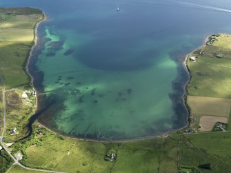 Oblique aerial view centred on Mill Bay on Hoy with possible submerged features visible, taken from the WSW.