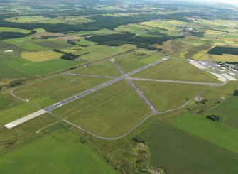 General oblique aerial view centred on the airfield, taken from the N.