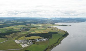 General oblique aerial view centred on the technical site (terminal) with the airfield adjacent, taken from the NNE.