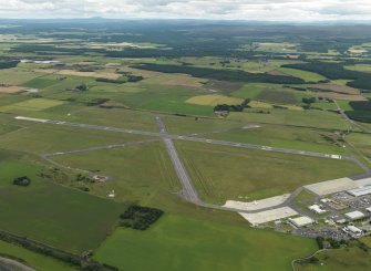 General oblique aerial view centred on the airfield, taken from the NW.