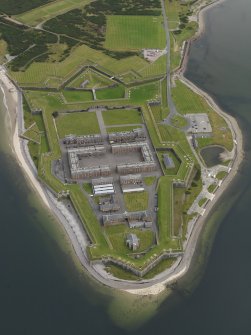 Oblique aerial view centred on the fortifications, taken from the W.
