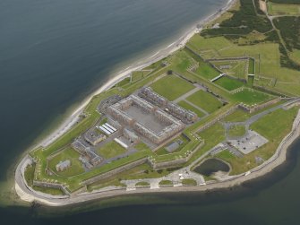 Oblique aerial view centred on the fortifications, taken from the SW.