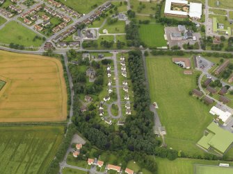 Oblique aerial view centred on the housing estate, taken from the SE.