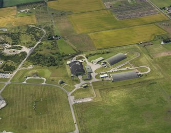 Oblique aerial view centred on the dispersal area, taken from the ENE.