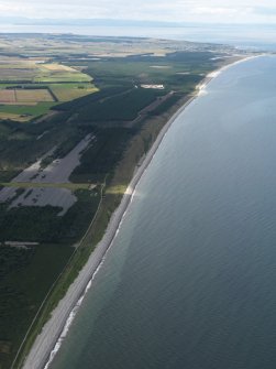 General oblique aerial view centred on the beach, taken from the ESE.