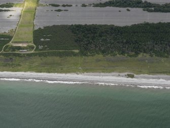 Oblique aerial view centred on the anti-tanks blocks with the rifle range adjacent , taken from the NNE.