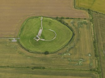 Oblique aerial view centred on the remains of the castle, taken from the SW.