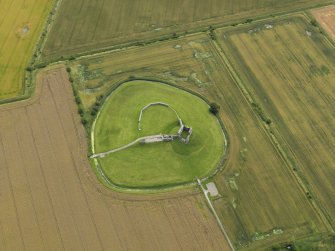 Oblique aerial view centred on the remains of the castle, taken from the N.