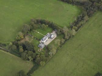 Oblique aerial view centred on the house, taken from the WSW.