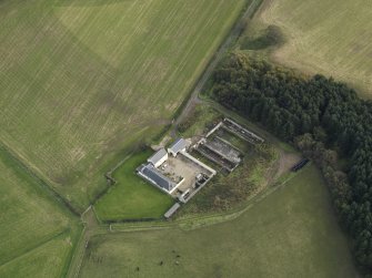 Oblique aerial view centred on the farmstead, taken from the NW.