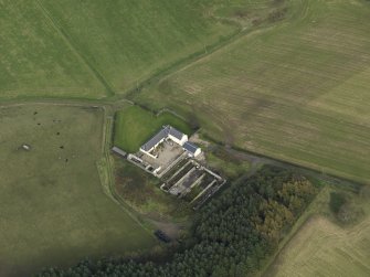 Oblique aerial view centred on the farmstead, taken from the SW.