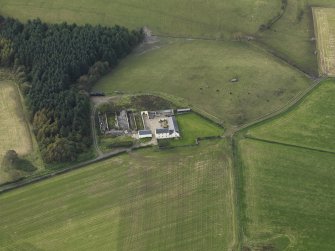 Oblique aerial view centred on the farmstead, taken from the ENE.