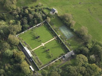 Oblique aerial view centred on the garden, taken from the NW.